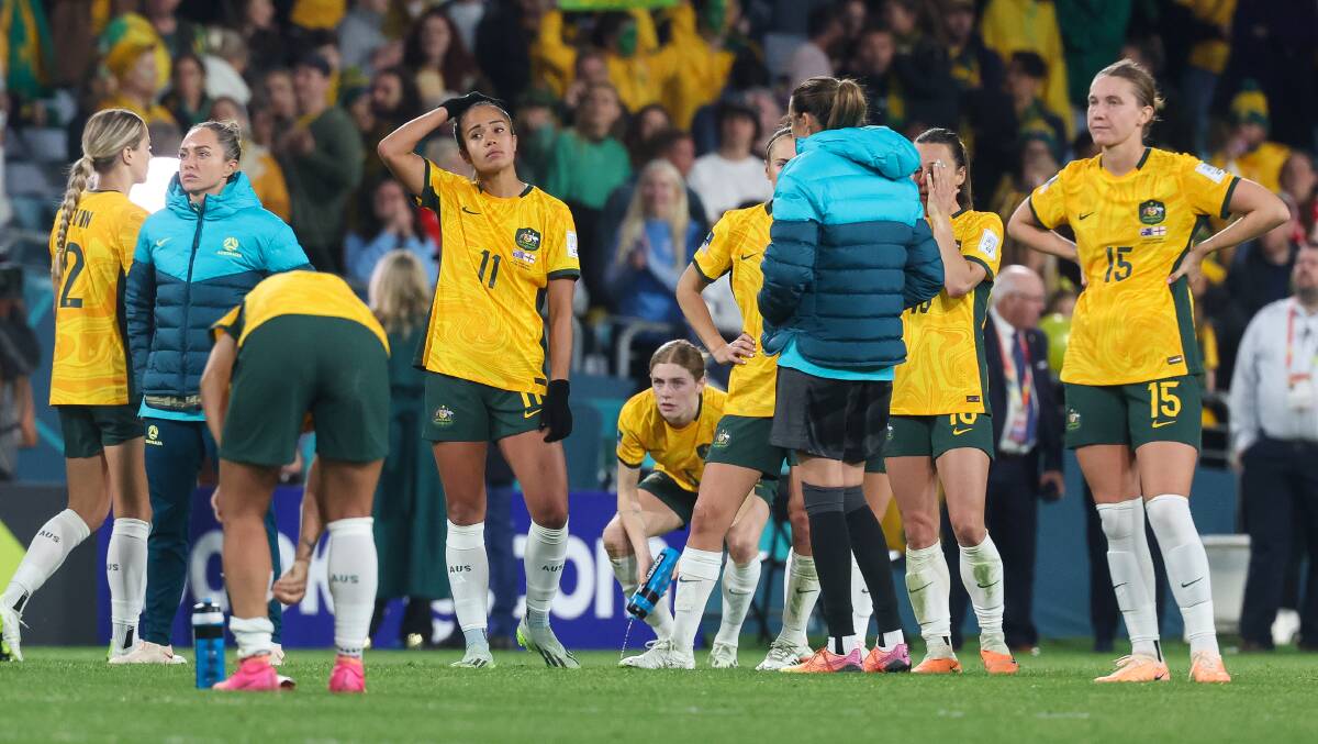 Mary Fowler (centre) reacts following the Matildas' 3-1 defeat to England on Wednesday night. Picture by Adam McLean