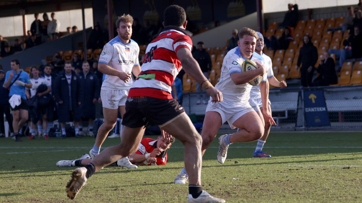 Queanbeyan Whites' winger Jackson Stuart on his way to scoring a try on Saturday. Picture by James Croucher
