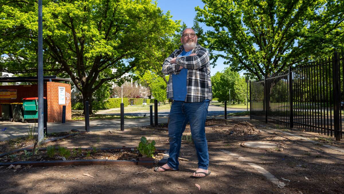 Craig Dinneen is a keen gardener and is hopeful of starting a community garden at Condamine Court. Picture by Gary Ramage