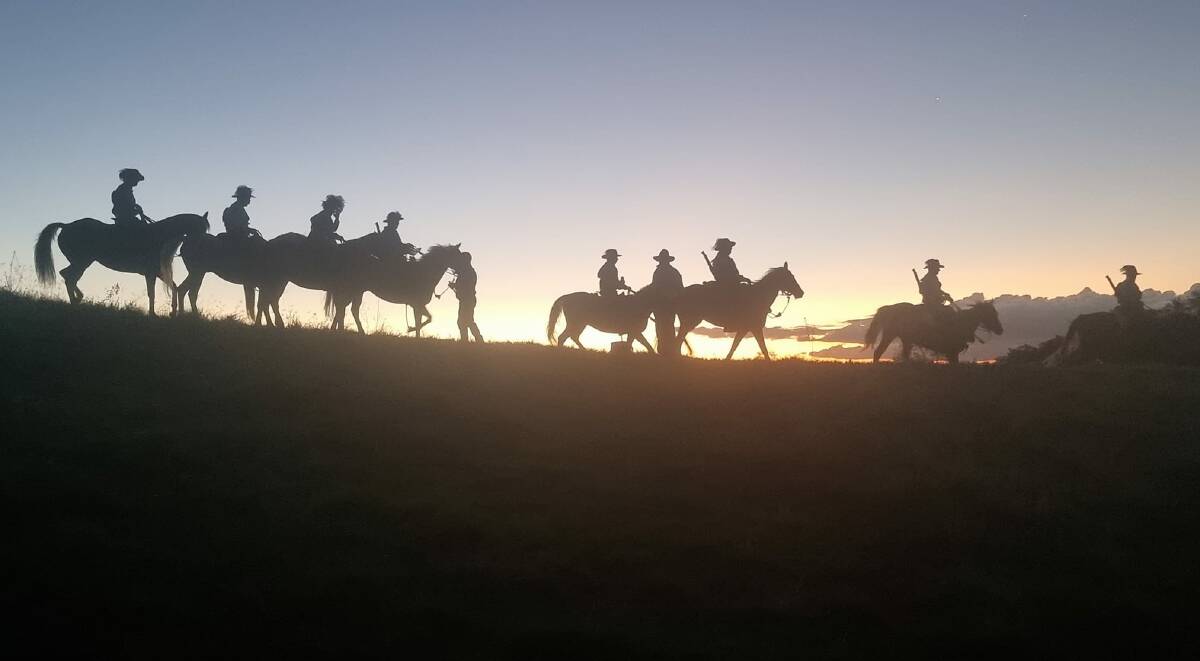 Light Horse troopers descending the mountain at sunset. Picture: Francine Rigby