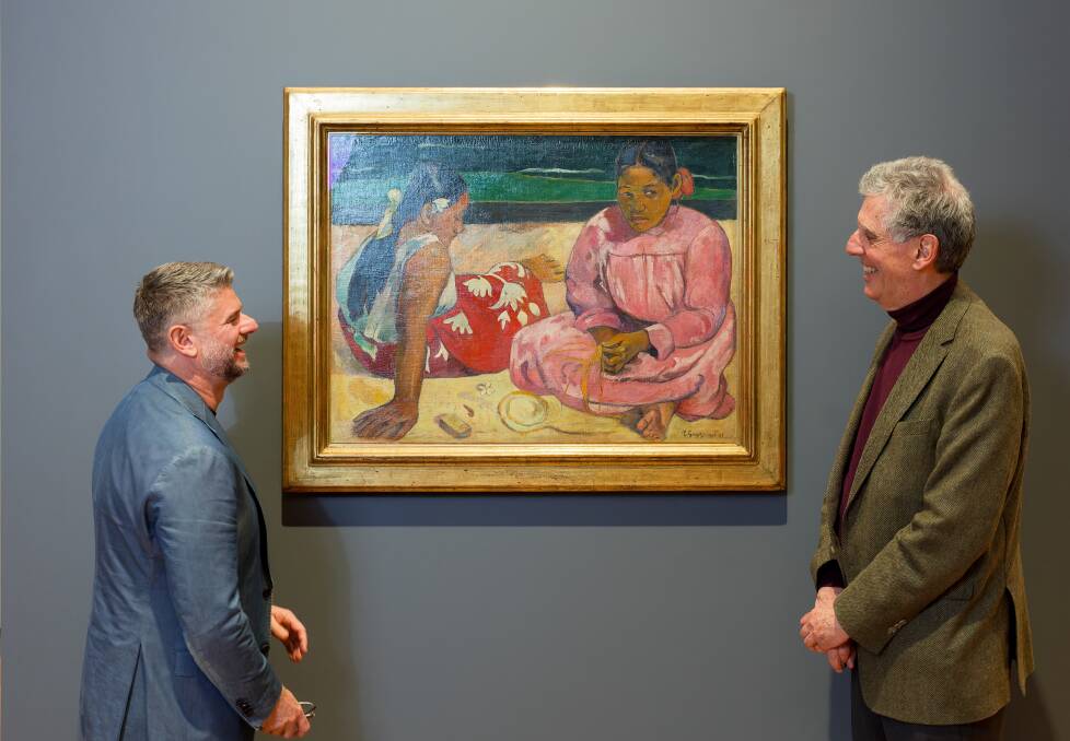 National Gallery of Australia director Nick Mitzevich and curator Henri Loyrette with one of Paul Gauguin's most famous works. Picture by Sitthixay Ditthavong