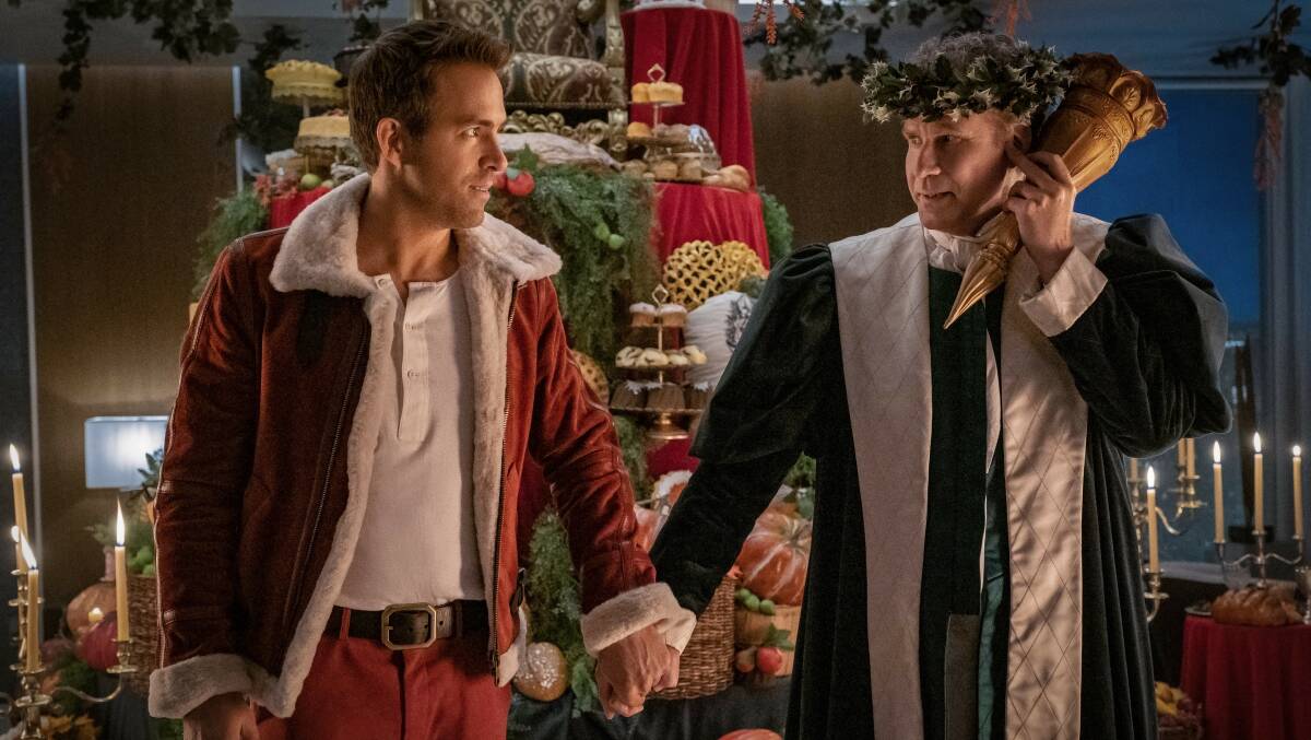 Ryan Reynolds and Will Ferrell in Spirited. Picture Apple TV