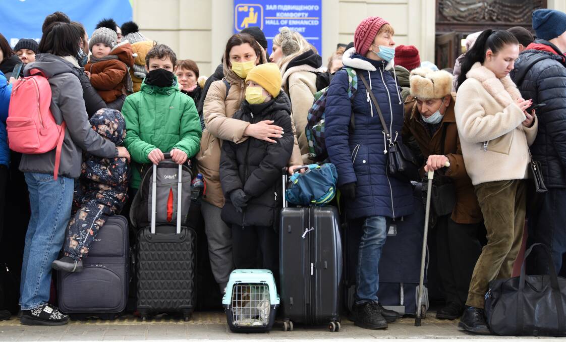 People in railway station of western Ukrainian city of Lviv waiting for the train to Poland, February 26, 2022. Picture Shutterstock