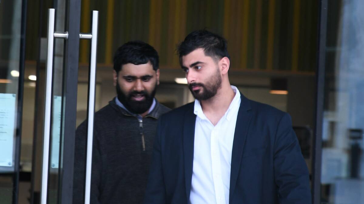 Majad Khan Khan and Amro Aseeri leave court on Wednesday. Picture by Hannah Neale