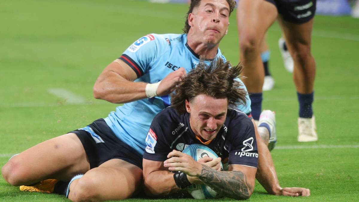 Corey Toole scores for the ACT Brumbies on Friday night. Picture Getty Images