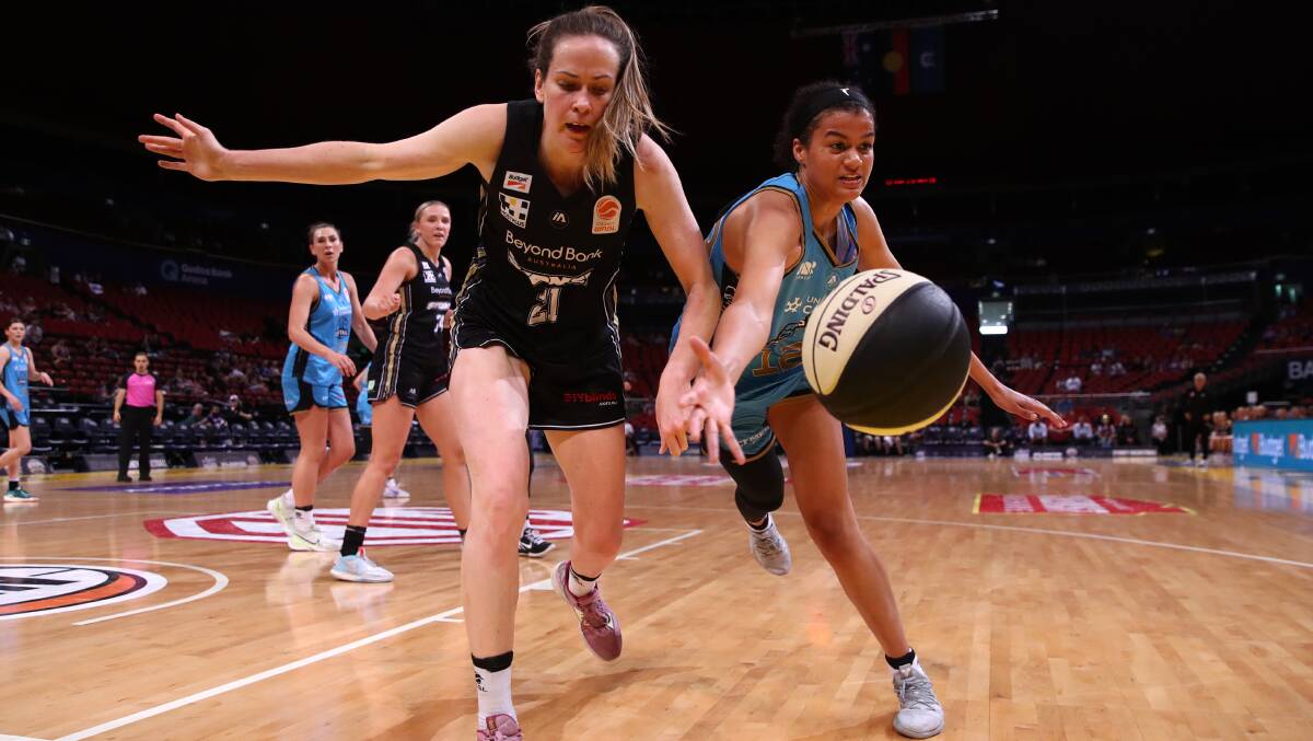 Rae Burrell, right, gave it her all as the Capitals fell to Sydney on Friday night. Picture Getty Images