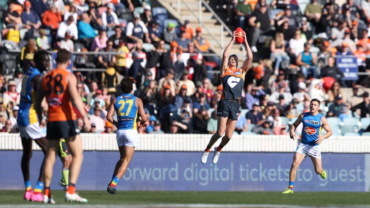 A big crowd watched the Giants prevail at Manuka Oval on Sunday. Picture by Sitthixay Ditthavong
