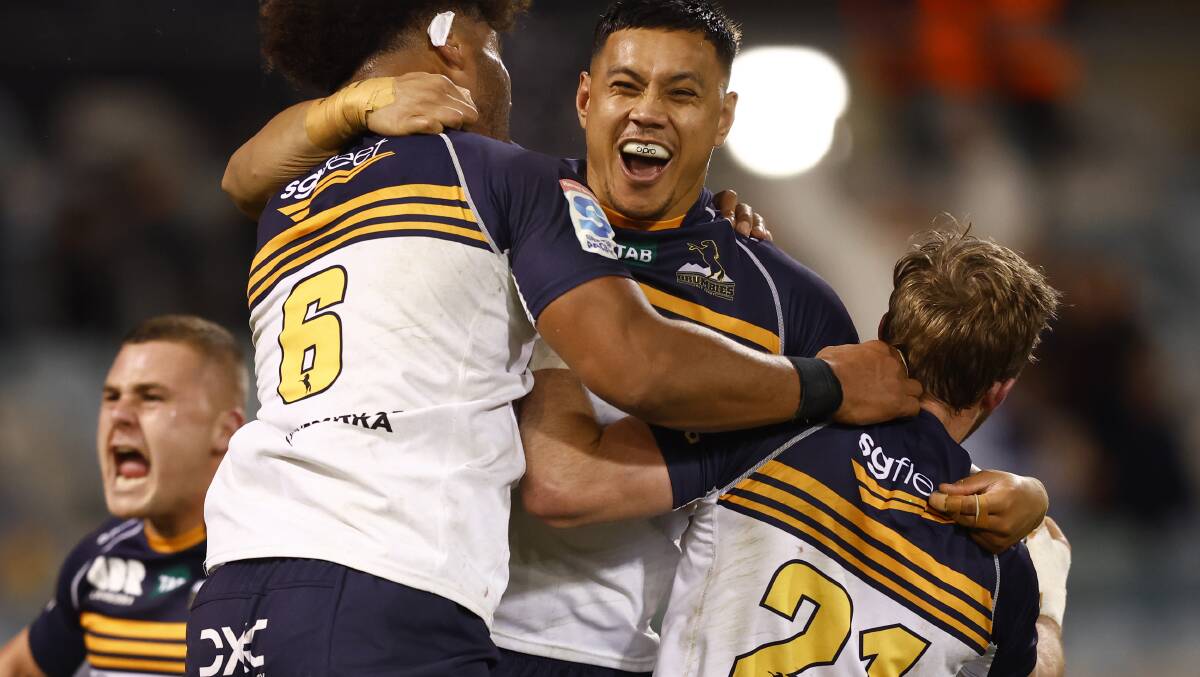 Len Ikitau and the ACT Brumbies celebrate Saturday's thrilling quarter-final victory. Picture by Keegan Carroll