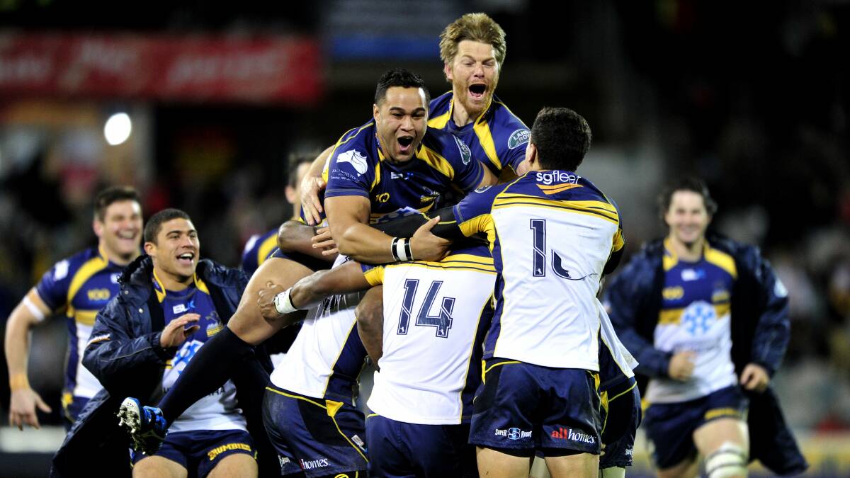 The ACT Brumbies celebrate their victory over the British and Irish Lions in 2013. Picture by Melissa Adams