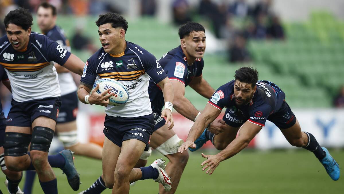 Noah Lolesio evades the Rebels defence on the way to the try line. Picture Getty Images