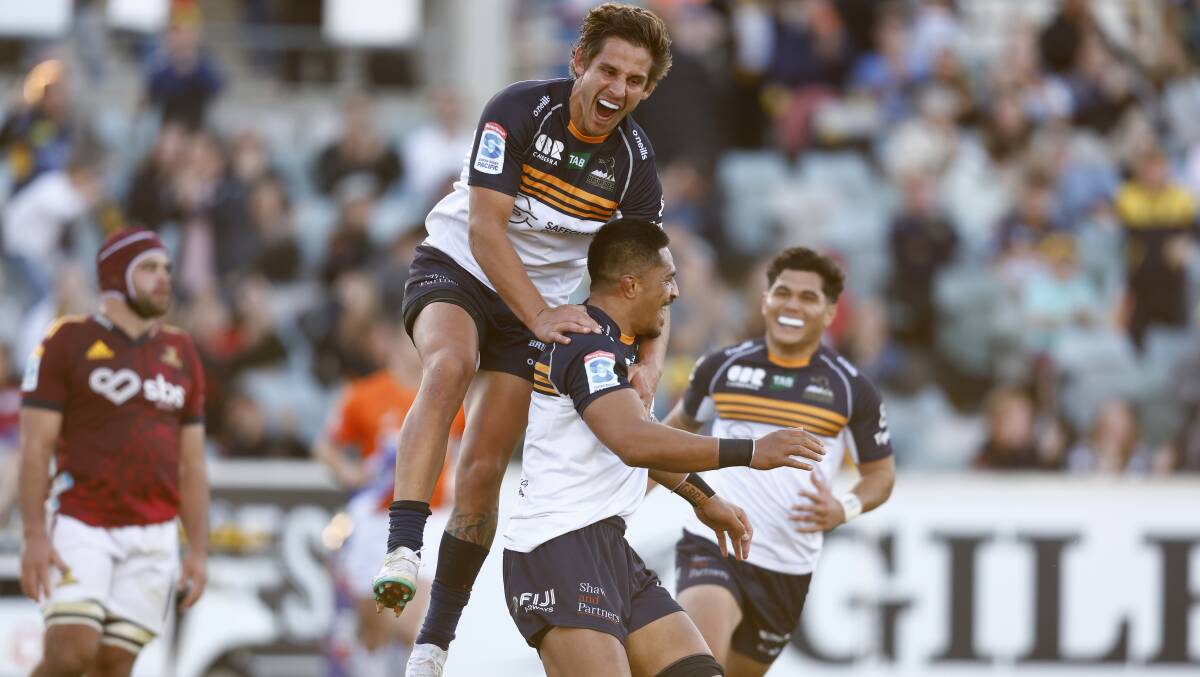 Ollie Sapsford celebrates Pete Samu's second try in Sunday's win over the Highlanders. Picture by Keegan Carroll