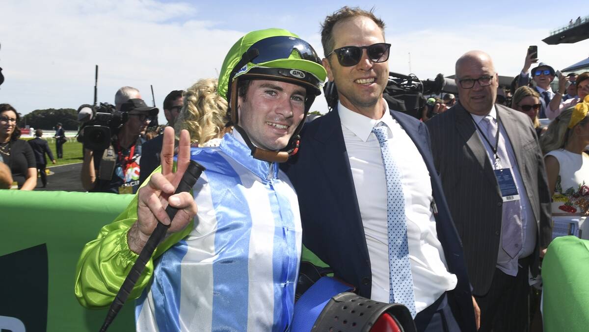 Jockey Tyler Schiller and trainer Matt Dale celebrate Front Page's victory in the Kosciuszko. Picture Bradley Photographers