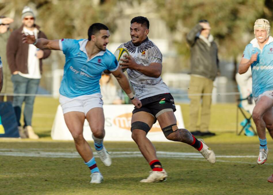 Gungahlin's Pete Samu evades Tom Wright in Saturday's win over Wests. Picture by Gary Ramage