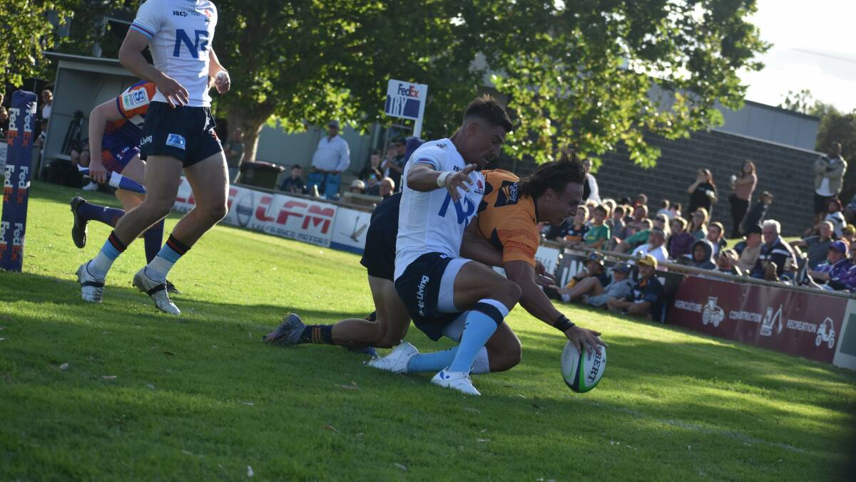 ACT Brumbies winger Corey Toole wins the race to the ball to cross in Saturday's trial victory over the NSW Waratahs. Picture by Liam Warren