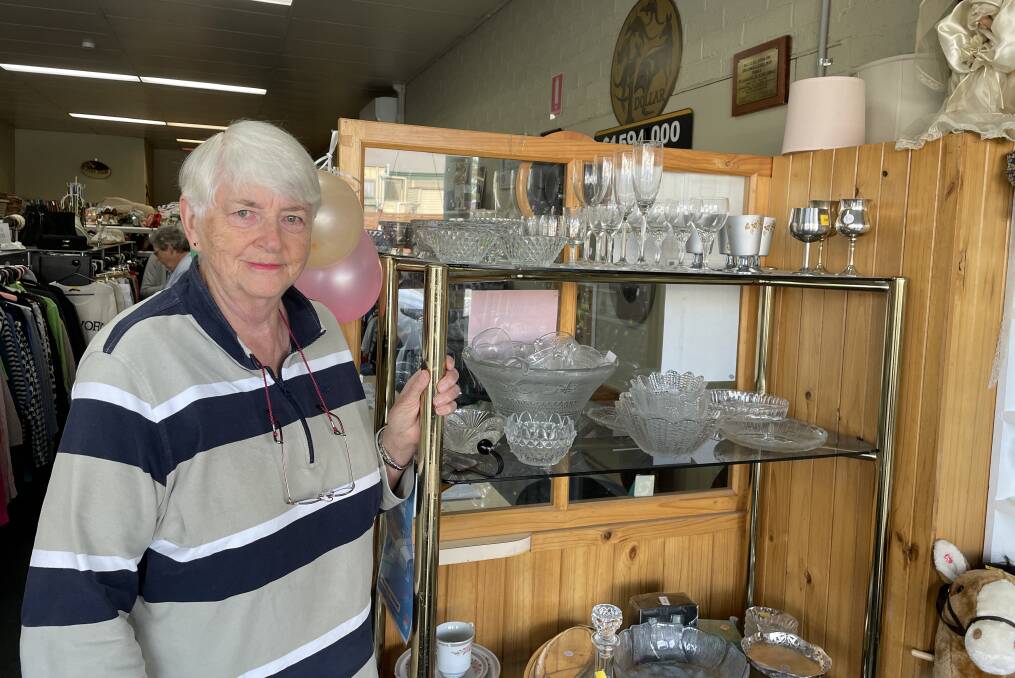 Alison Jenkins with some of the glassware for which the Op Shop is renowned.