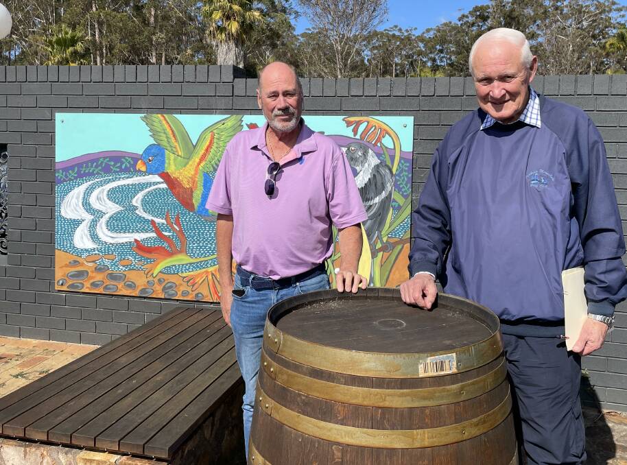 Philip Saunders and Tony Freeman of the Pambula Merimbula Golf Club in the courtyard outside the 28th Cafe. Picture by Denise Dion