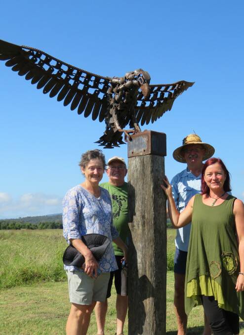 Panboola committee members with the returned eagle at its new location.
