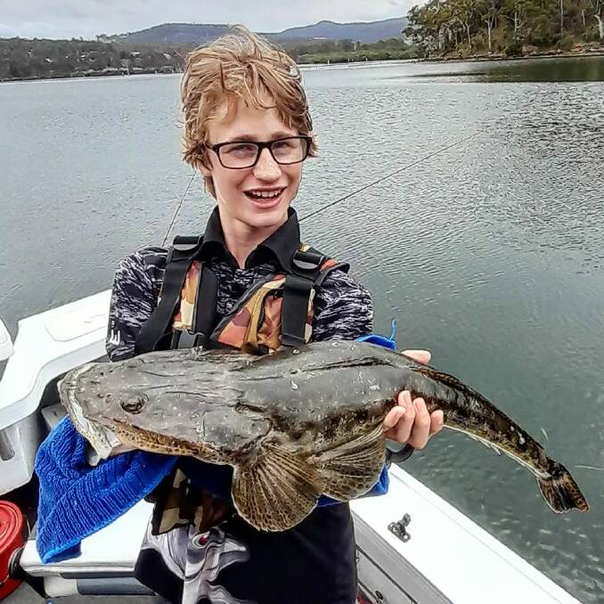 Joe Major of Maroochydore shows a lovely dusky flathead taken in the Merimbula Top Lake using a lure called a frenzy deep-diver. 