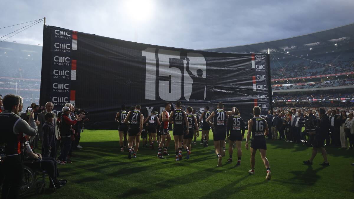 St Kilda runs onto the field for its 150th anniversary match at the MCG on April 1. Picture by Getty Images