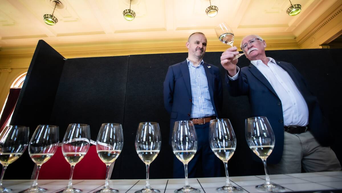 Chief Minister Andrew Barr and winemaker Ken Helm dissect a riesling. Picture by Karleen Minney