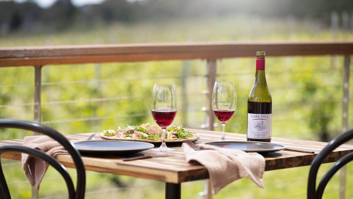 Dine on the deck at Agostini's at Lark Hill Winery. Picture supplied