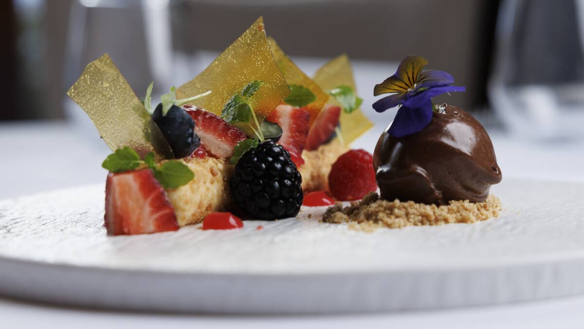 White chocolate cheesecake, burnt butter crumbs, autumn berries, lemon balm, chocolate sorbet. Picture by Keegan Carroll