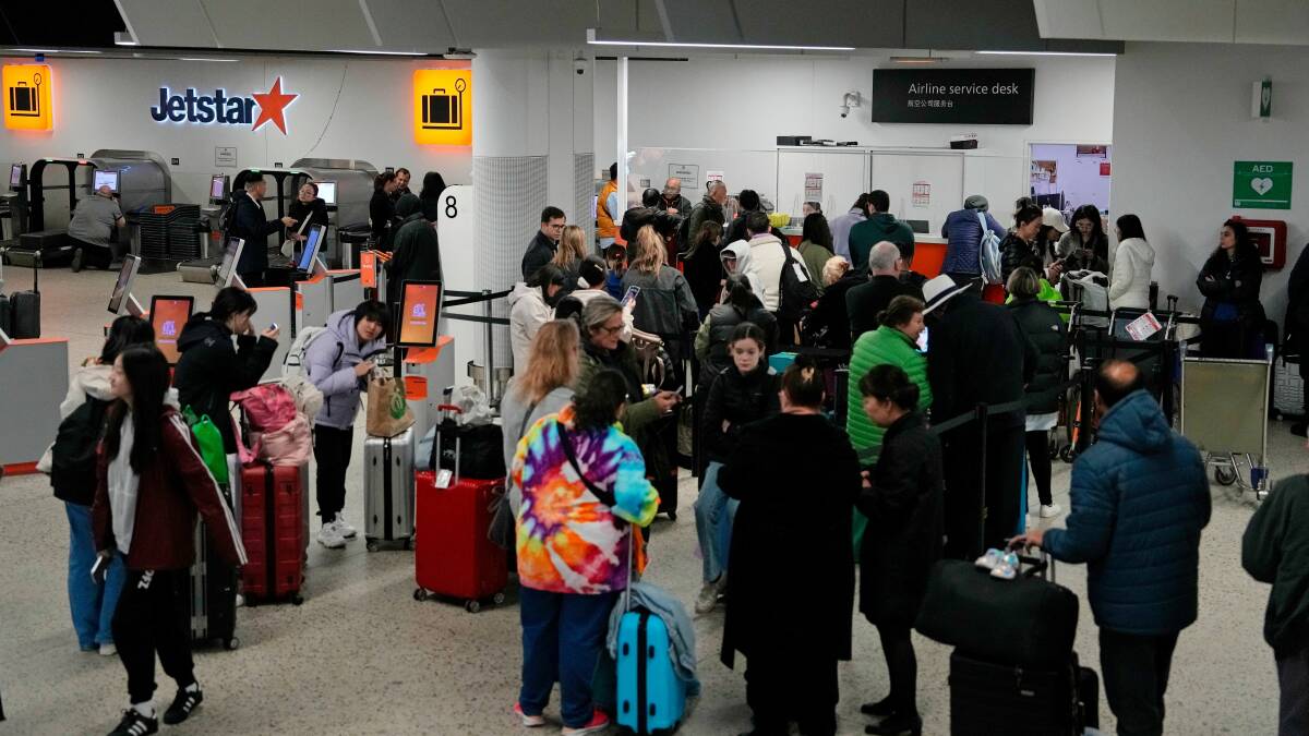 Passengers at Melbourne Airport faced frustrating delays amid Friday's global IT outage. Picture Getty Images