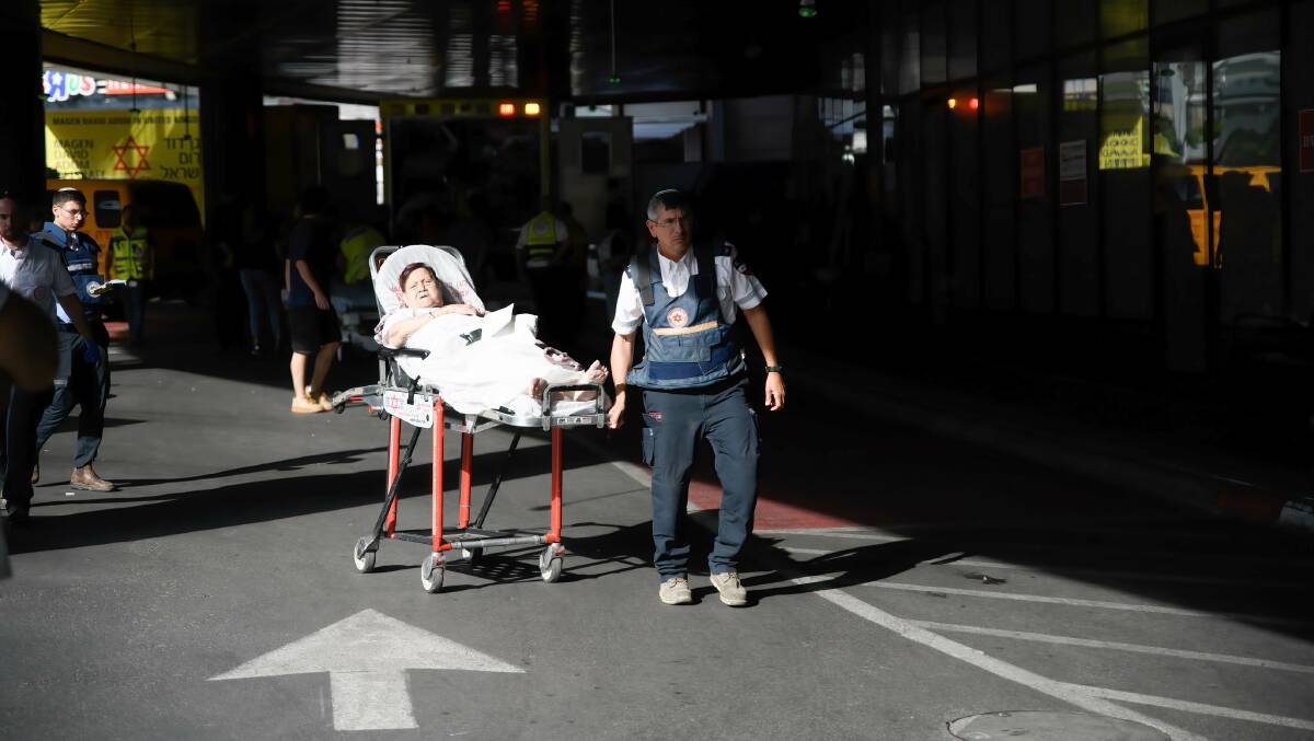 Medics push a wounded woman at the emergency entrance to the Ichilov hospital in Tel Aviv following a Hamas incursion into Israeli settlements around the Gaza strip. Picture Getty Images