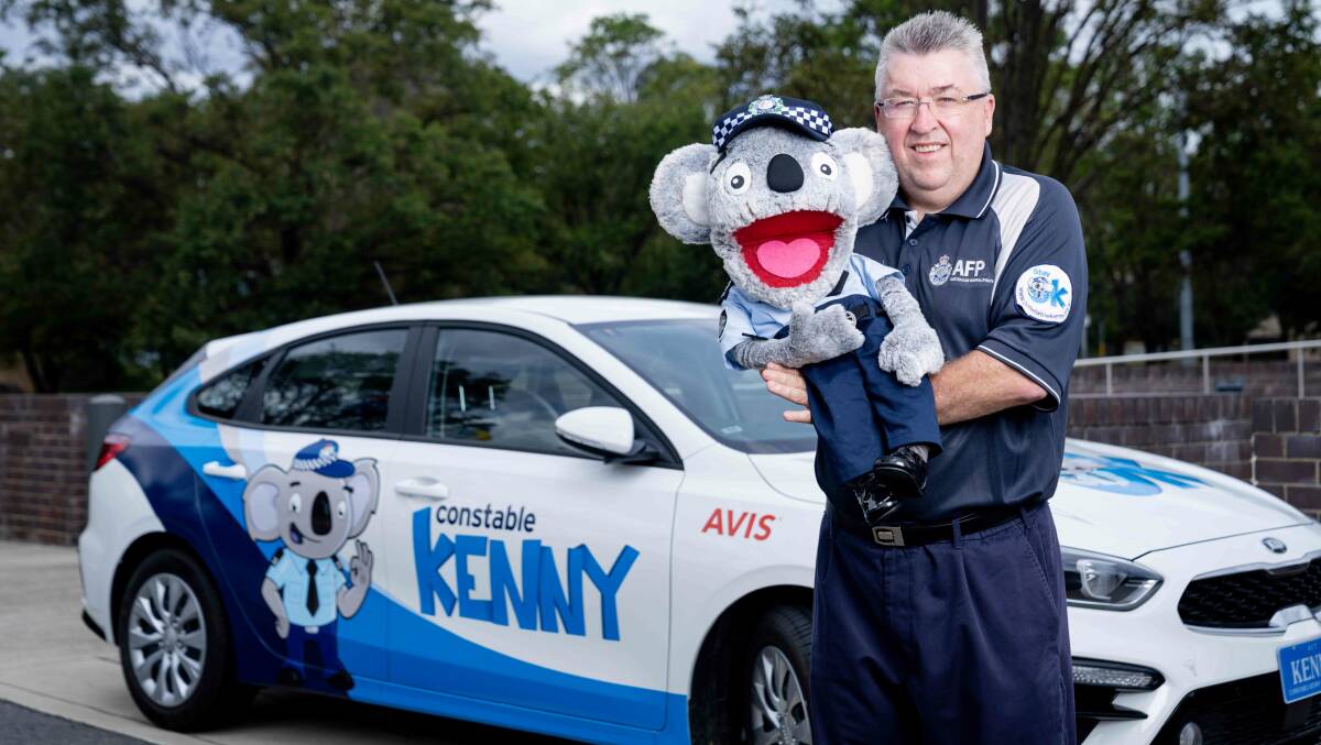 Constable Kenny Koala with handler David Packwood. Picture: ACT Policing