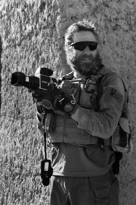 Photographer Gary Ramage with his Hasselblad 500CM camera in Afghanistan in 2011. The camera was later donated to the Australian War Memorial and is now part of the national collection on Afghanistan. Picture by ADF photographer PO Damien Pawlenko
