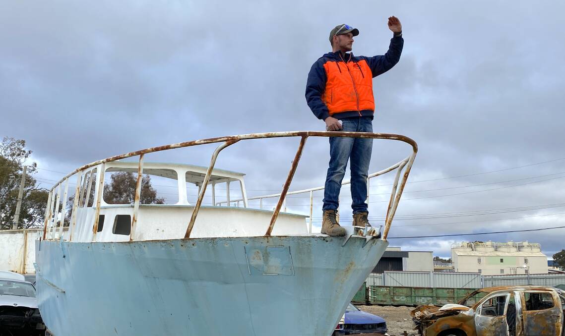 Sam Welsh of Access Metal Recycling can't bring himself to cut the boat into pieces. Picture by Tim the Yowie Man