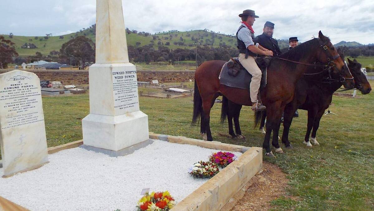 Wes Leseberg and his colleagues recently restored the grave of Sergeant Parry and Senior Constable Webb-Bowen at North Gundagai Cemetery. Picture by Wes Leseberg