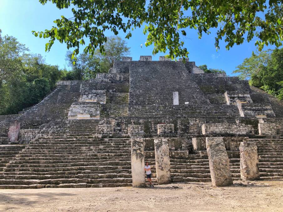 Michael Turtle stands in front of a temple at Calakmul for scale (can you spot him?)