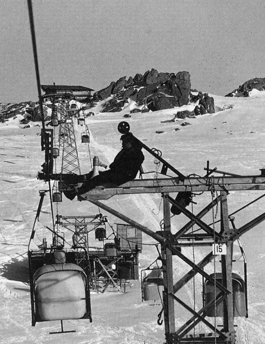 A worker takes a rest, possibly after resetting the cable on The Alpine Way to Charlotte Pass chairlift. Picture: Baglin/Perisher Historical Society