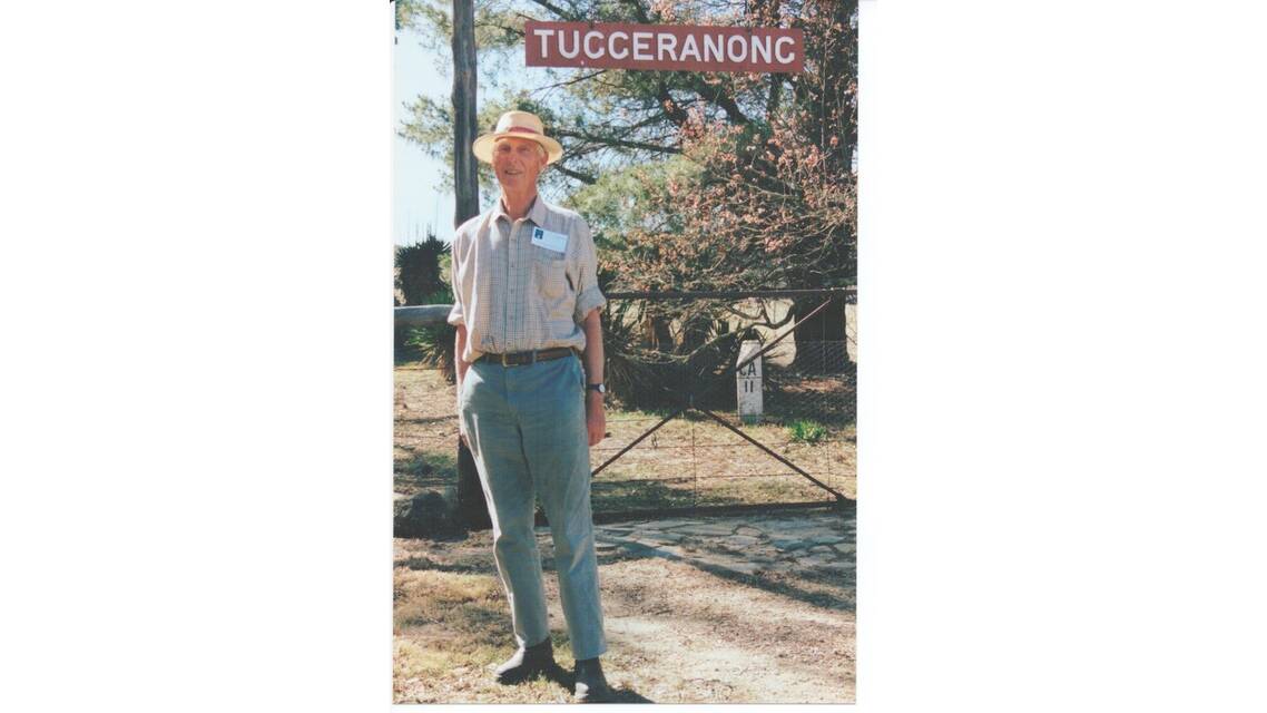 The late Harold Adams of Melrose Valley Homestead with the original Tuggeranong Railway Station sign. Picture: Courtesy of Rebecca Lamb