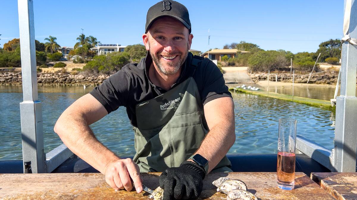 Learning how to shuck oysters. Picture by Michael Turtle 
