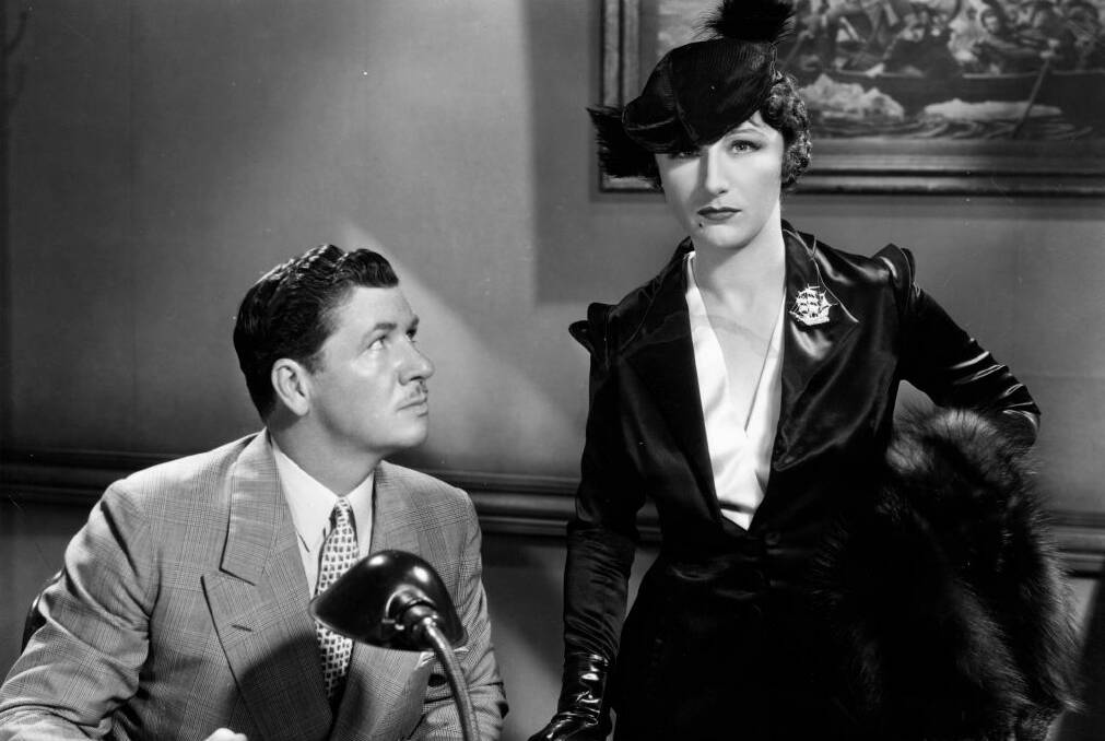 With George Bancroft in a scene from the film Blood Money.