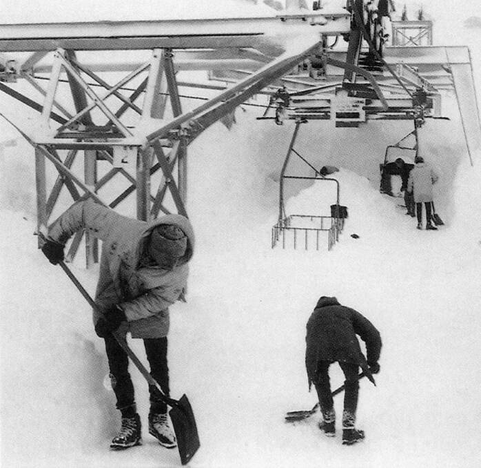 Digging out the Alpine Way to Charlotte Pass Chairlift after a 1964 blizzard. Skiers who cleared snow for two hours received a free day lift pass. Picture: Baglin/ Perisher Historical Society