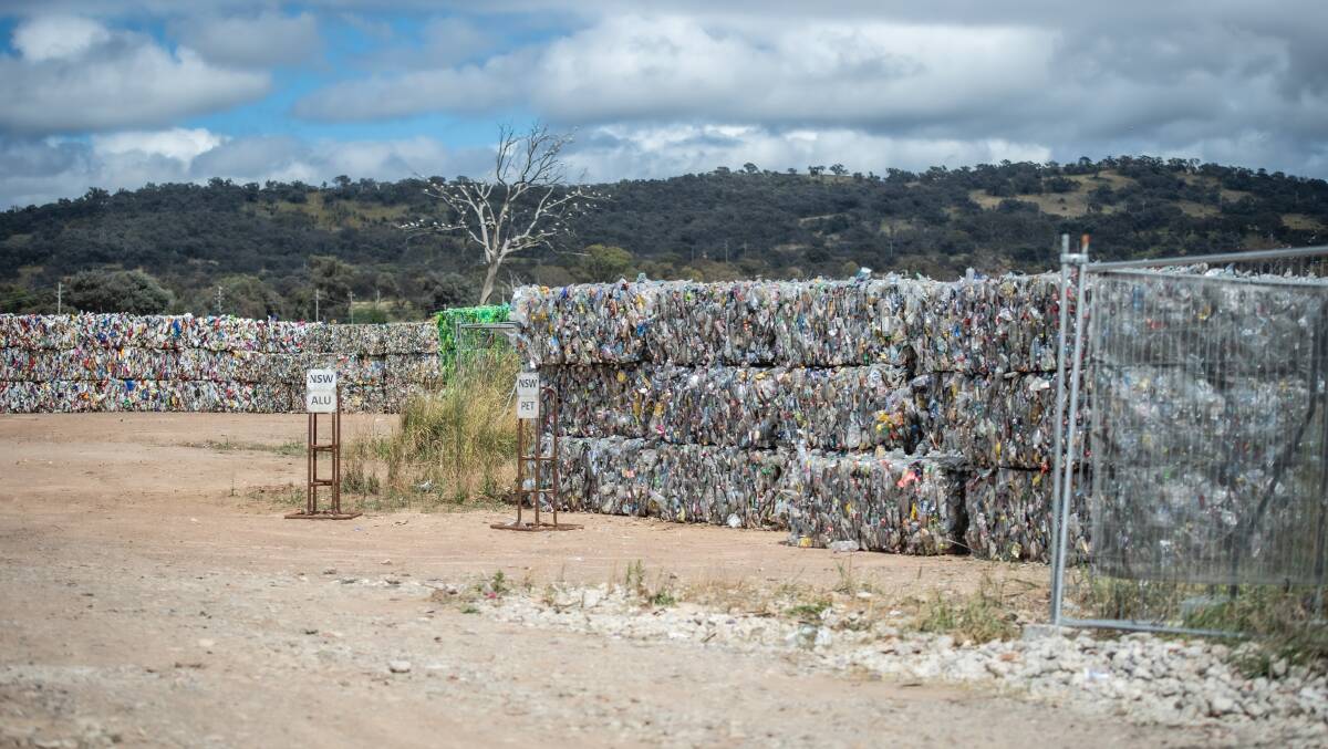 Tonnes of baled recycled material are stored outside at Hume, waiting for transportation. Picture by Karleen Minney