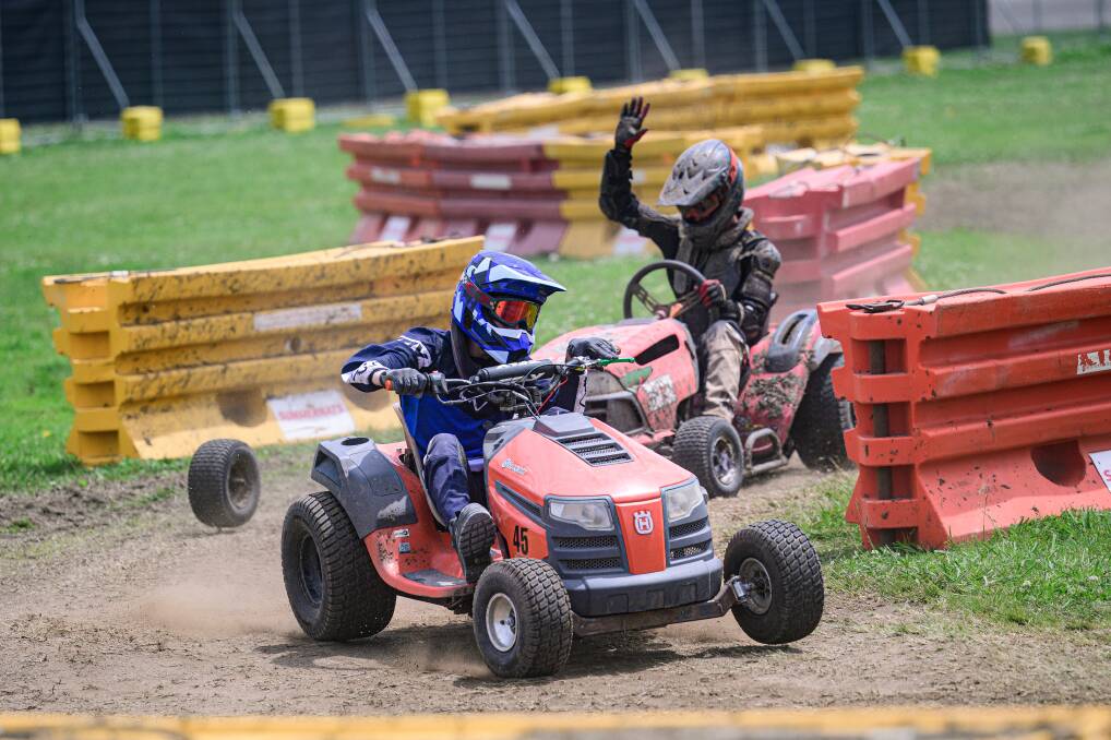 A wheel snaps off as the lawnmowers race around the main arena. Picture by Sitthixay Ditthavong 