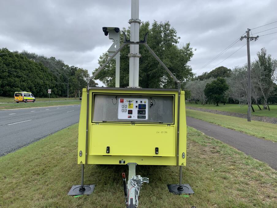 These flouro-painted devices will be moved around locations in the ACT to catch motorists using their phones while driving. Picture by Peter Brewer