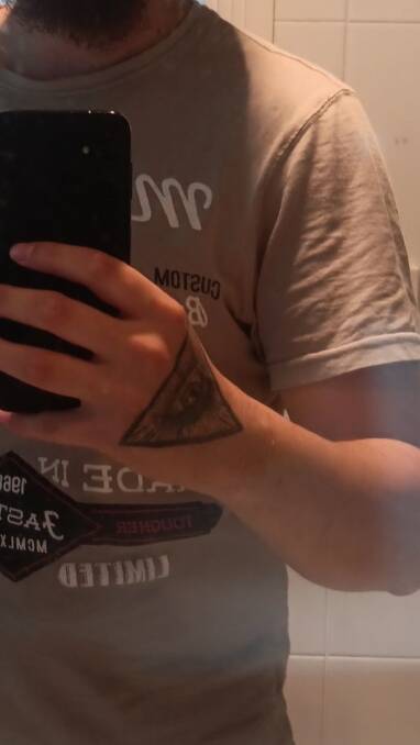 The distinctive tattoo on the back of the missing man's hand. Picture NSW Police