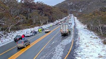 The busy snow chain layby at Wilsons Valley on Tuesday morning. Picture supplied