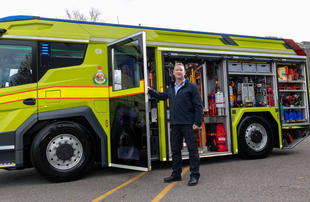 ACT Chief Fire Officer Matt Mavity with the new hybrid-electric fire truck. Picture by Gary Ramage 