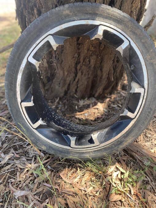 A wheel left behind on Mulligan's Flat Rd after the internal spokes were sheared off by a huge pothole. Picture by Peter Brewer 