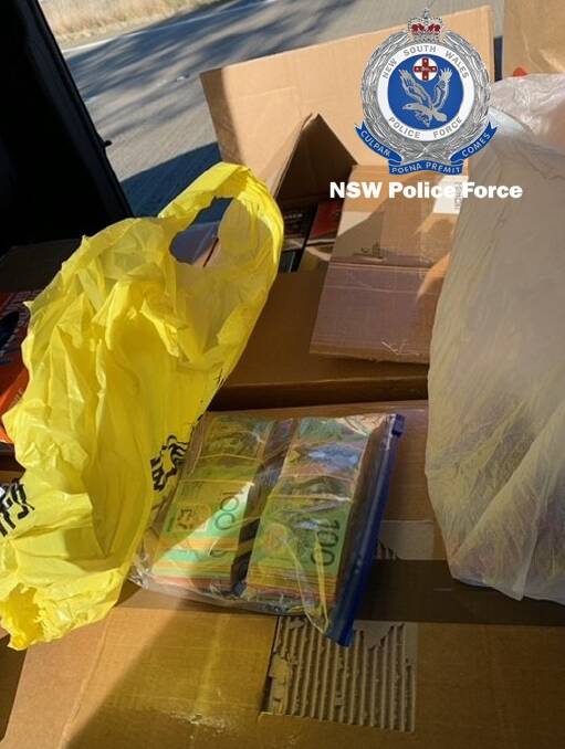 Cash and tobacco products seized in the Hume Highway traffic stop. Picture from NSW police