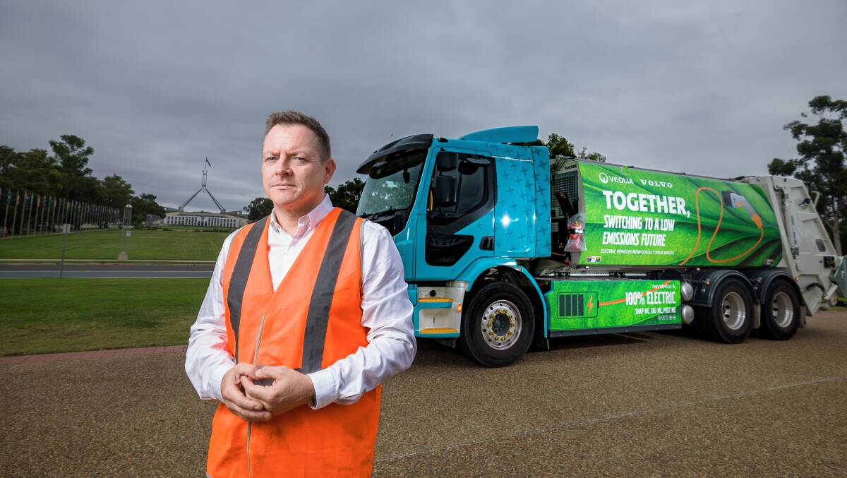 Veolia waste management boss Richard Kirkman with the electric refuse collection truck. Picture by Sitthixay Ditthavong 