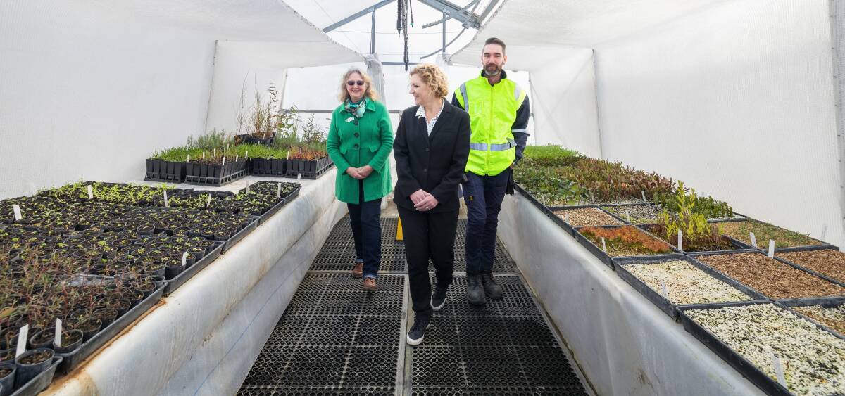 Landcare's Annaliese Caston, Corrections Minister Emma Davidson and AMC's horticulturalist Leigh in one of the greenhouses at the prison. Picture by Sitthixay Ditthavong 