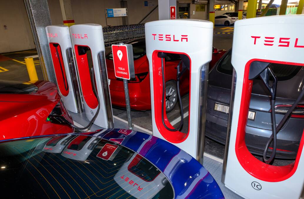 Teslas recharging in Tuggeranong. Picture by Sitthixay Ditthavong
