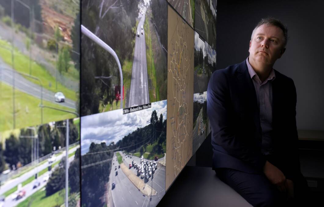 Executive director Tim Rampton in front of the huge display screen of Canberra's arterial and city roads displayed inside the Traffic Operations Centre. Picture by James Croucher